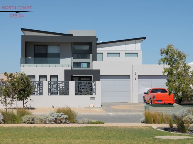 two-storey custom canal house design in Perth, Mandurah Canals. Split butterfly roof design with grey and black render